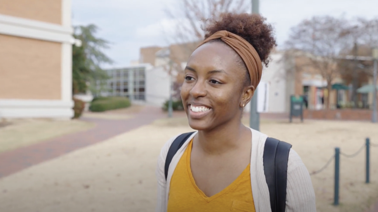 Ebony Gaillard, Ph.D. Candidate walking on campus