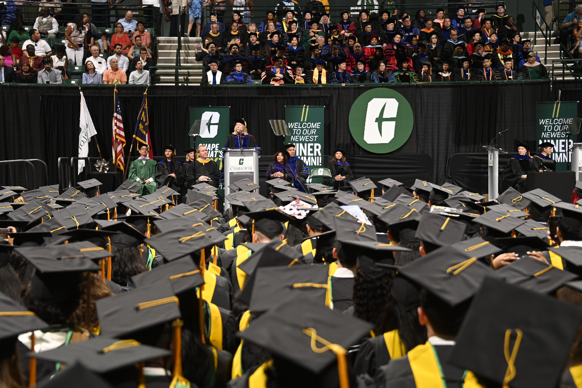 Graduate students in crowd at commencement