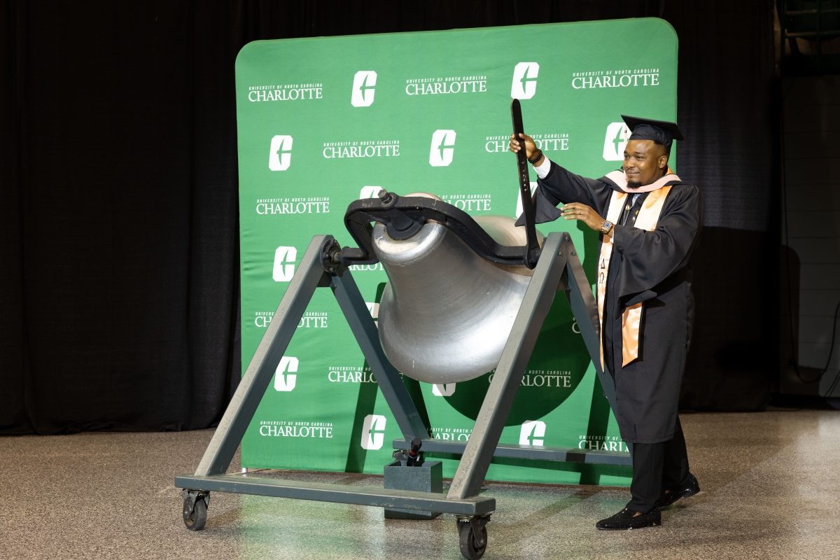 Unique Kumtap, Master’s in Public Health ‛24, served as a bell ringer for the Spring 2024 Graduate School commencement.