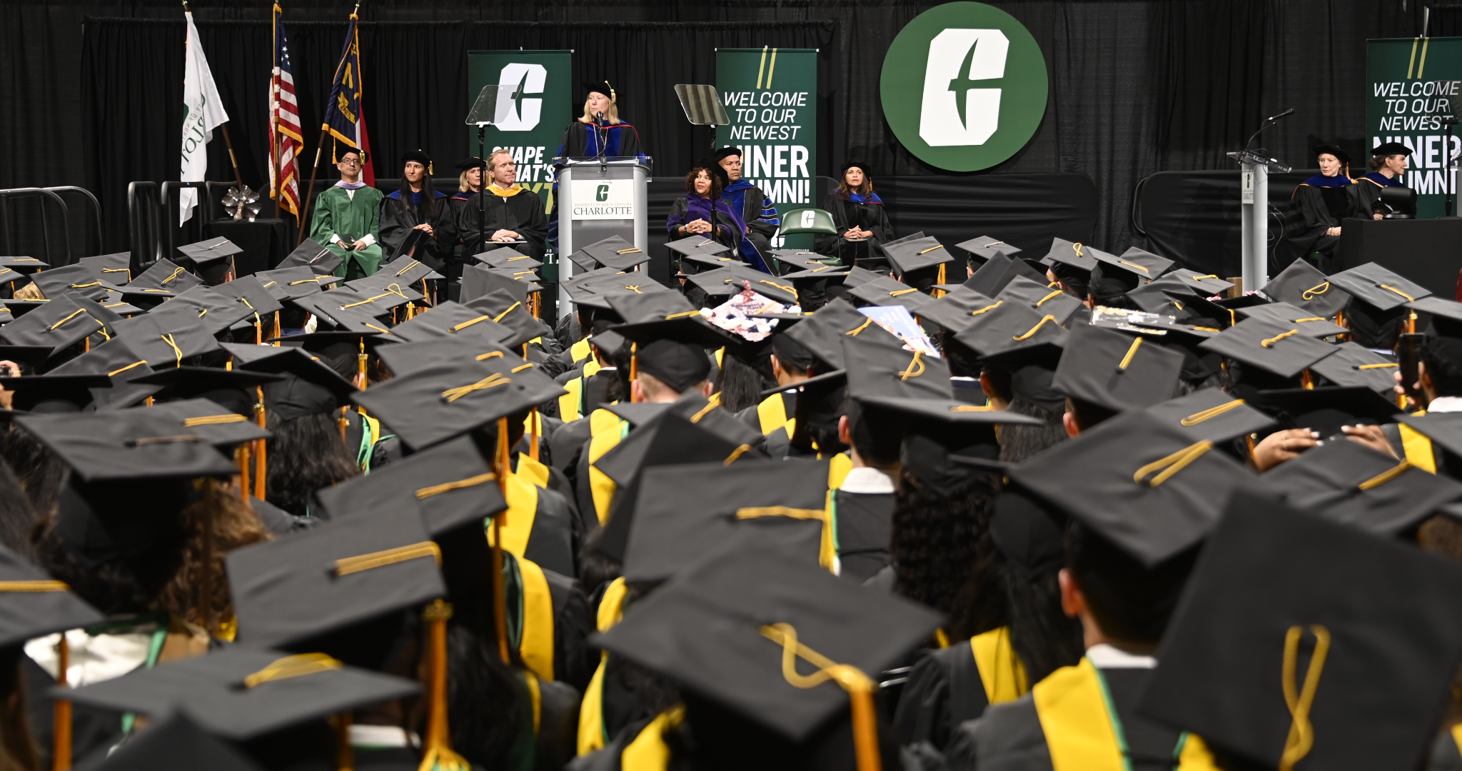 Graduate students at commencement listen to Chancellor Gaber's remarks