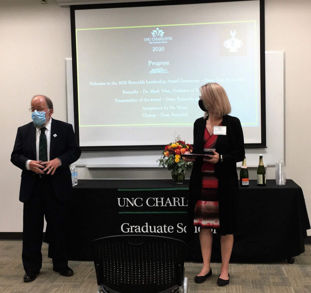 Dean Reynolds presents Dr. Lara Vetter with the Reynolds Leadership Award for 2020. Dean Reynolds presents Dr. Lara Vetter with the Reynolds Leadership Award for 2020.
