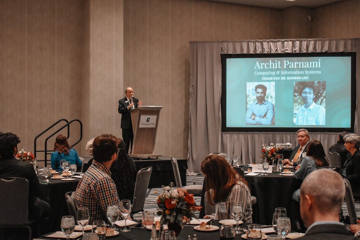 Dean gives remarks on stage