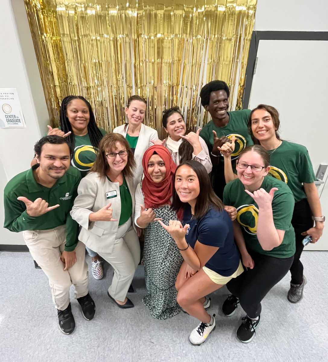The Graduate Life Fellows and Advocates pose in the photo booth during the Open House.