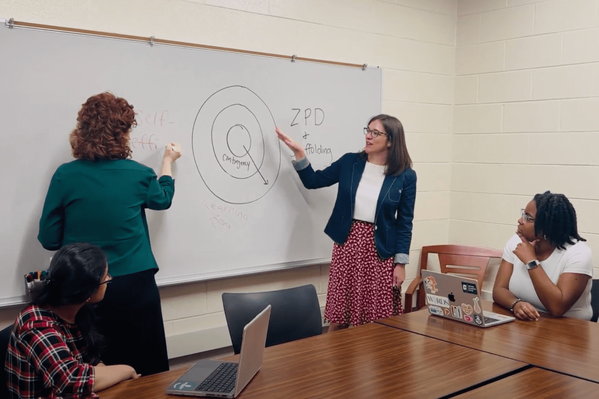 Faculty and students working together in the GPWC