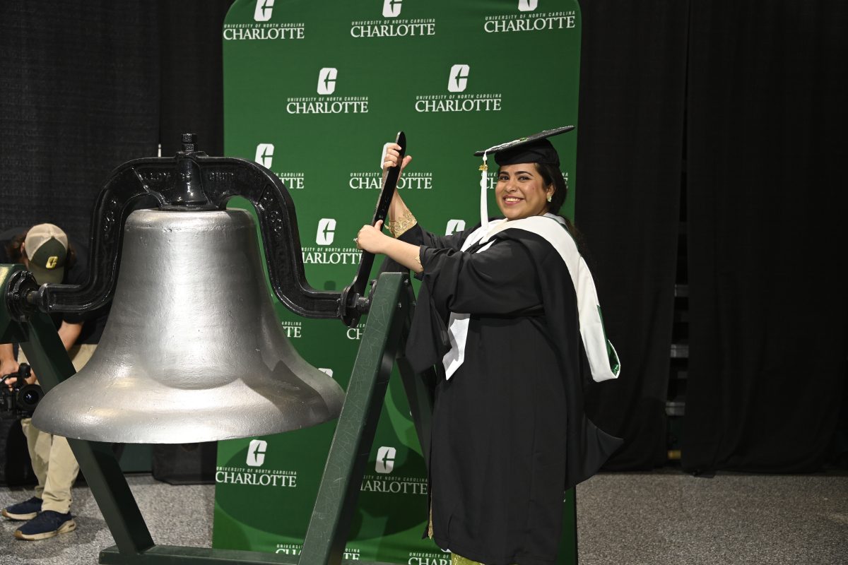Mahrukh Maqsood performs her duties as the Bell Ringer during Friday’s commencement ceremony.